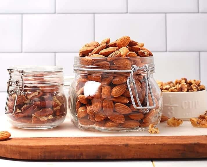 Almonds and pecans in glass jars