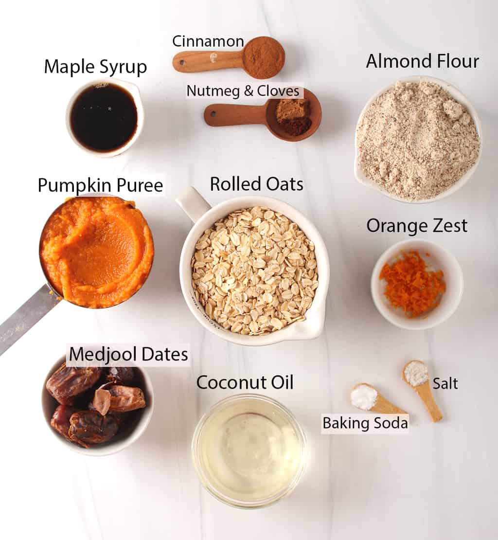 cinnamon, nutmeg, cloves, almond flour, maple syrup, pumpkin oats, orange, dates, oil, baking soda, salt